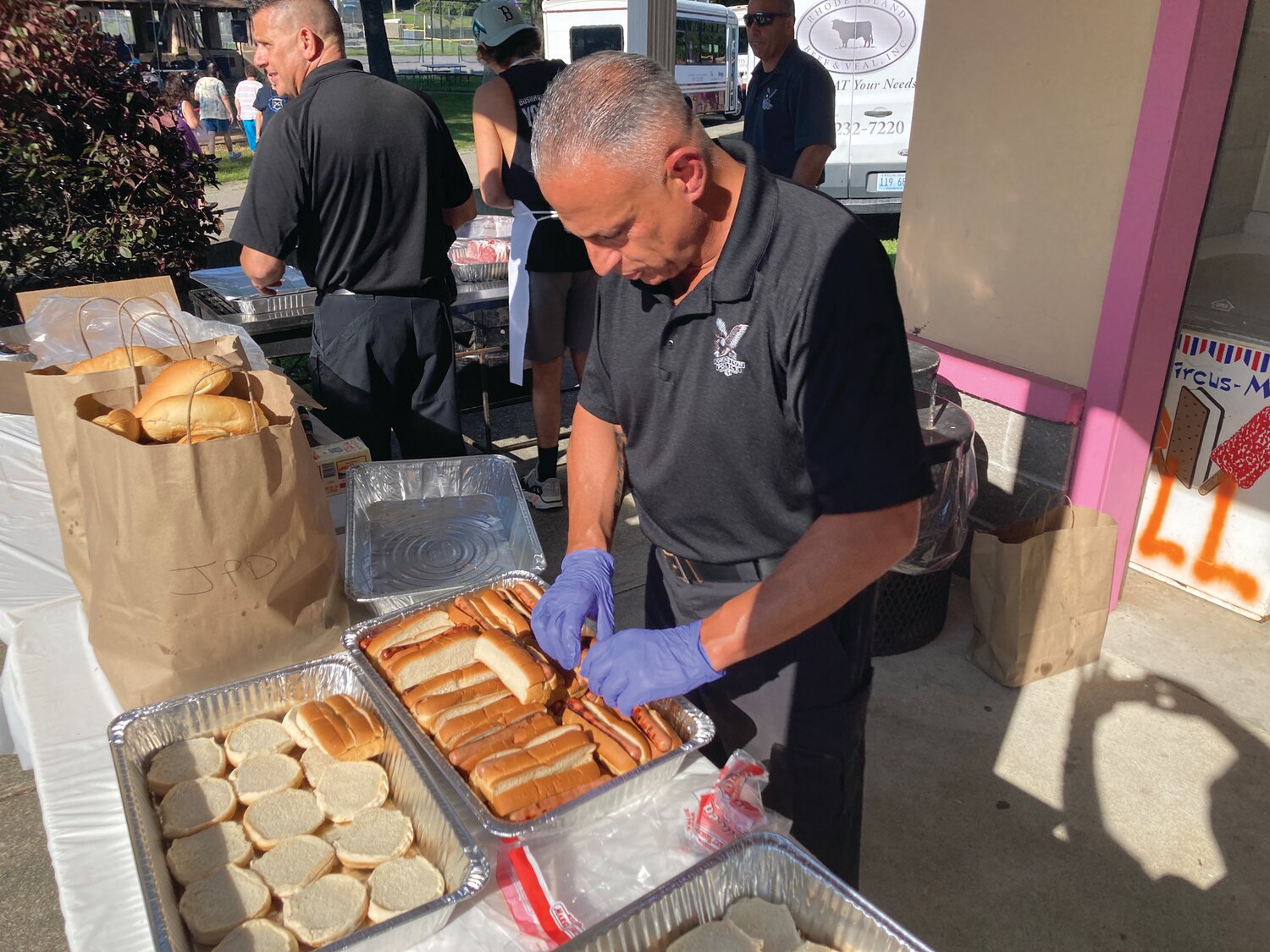 HOT DIGGIDY DOG: Officer Michael Andreozzi paired hundreds of hot dogs with buns during National Night Out 2023.